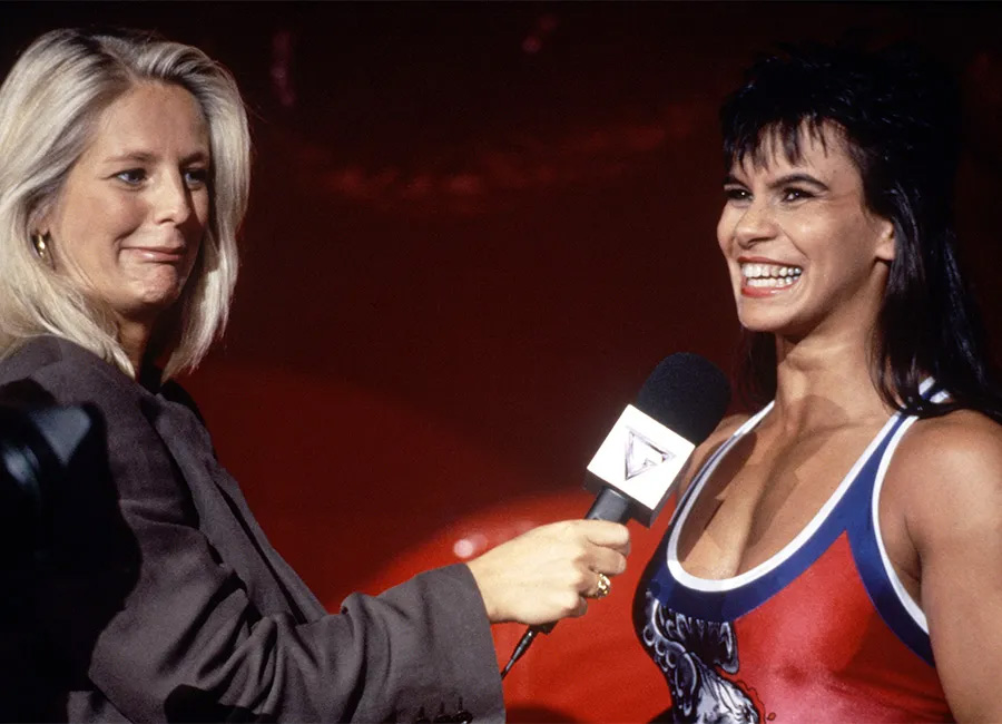 Falcon enjoys a giggle with Gladiators presenter Ulrika Jonsson after an event.