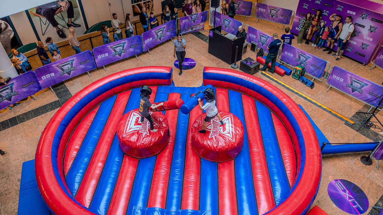 Children take on the a special version of Duel, whilst other fans meet the Gladiators and pose for photographs at a previous Gladiators fan activation event.