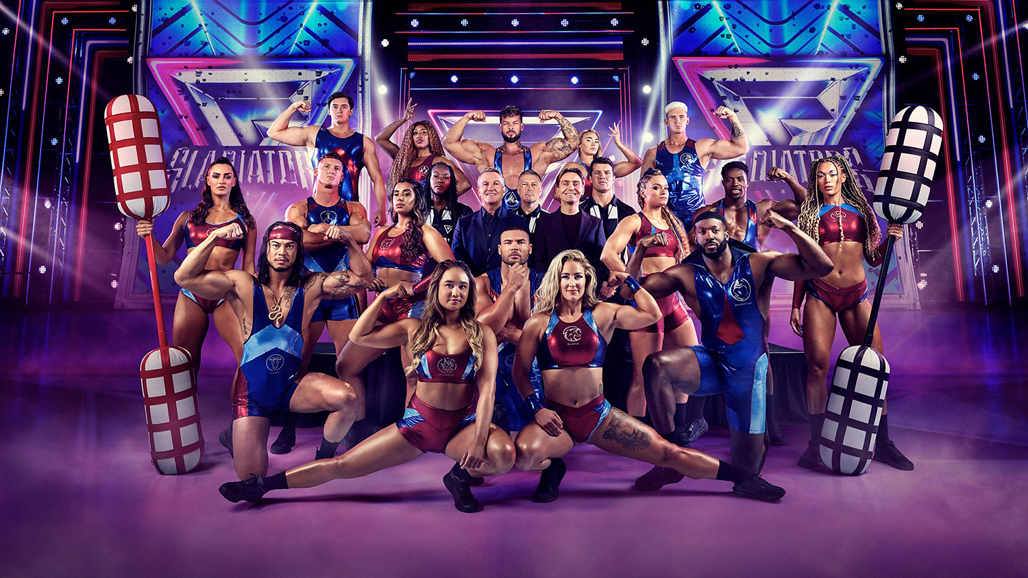 The cast of Gladiators Series 2 (2025) including the 16 Gladiators, Bradley and Barney Walsh, plus the referee team — Mark Clattenburg, Sonia Mkoloma and Lee Phillips.